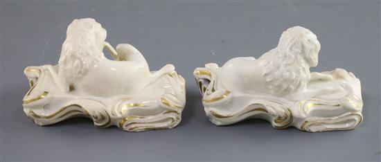 A pair of Derby porcelain figures of recumbent poodles, c.1825-45, L. 10.5cm, one restored